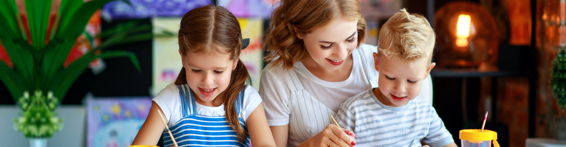 woman with children doing painting
