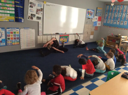 teacher teaxch their student about yoga