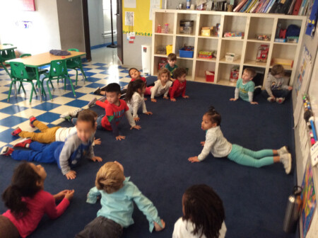 children practice a yoga in school