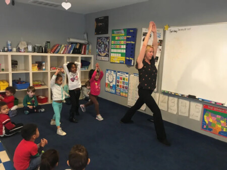 teacher teaxch their student about yoga