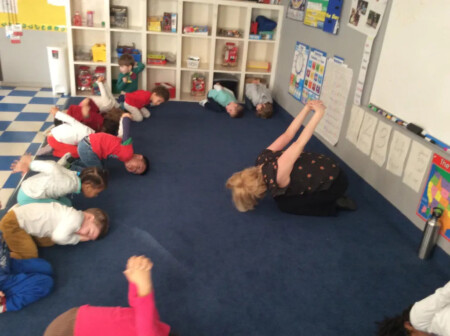 teacher teaxch their student about yoga